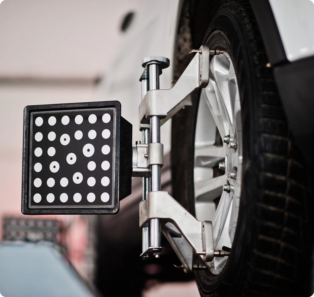 Mechanic-Checking-Wheel-Alignment