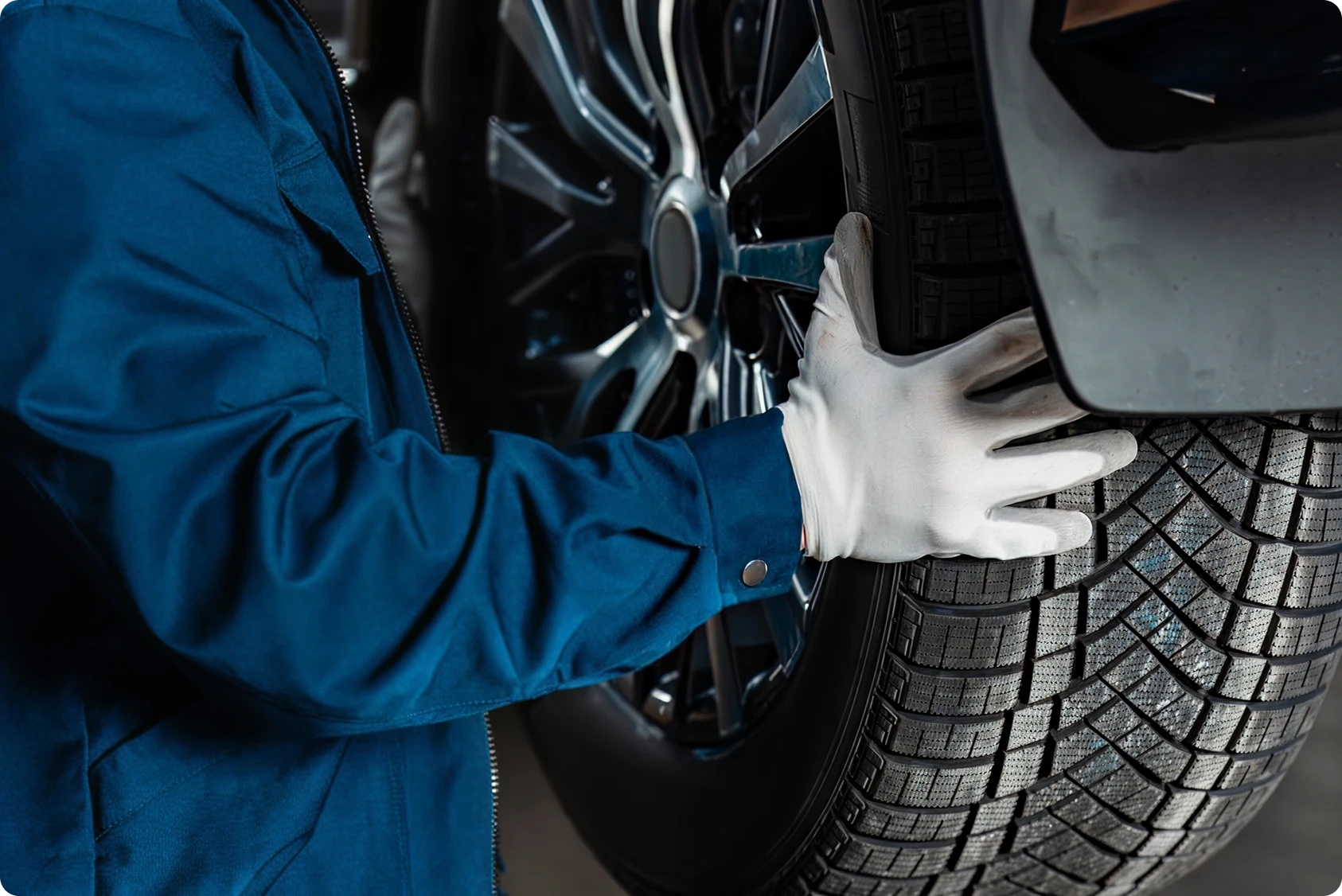 mechanic installing tire