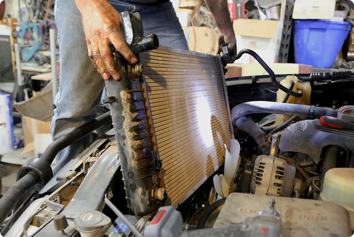 mechanic with black rubber gloves preparing to rem