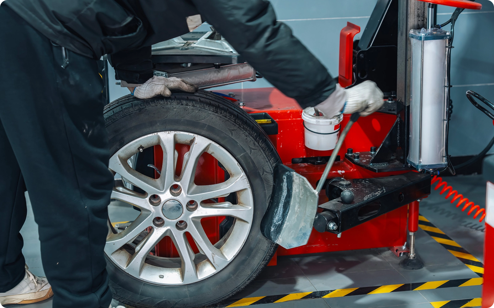 auto mechanic changing car tire
