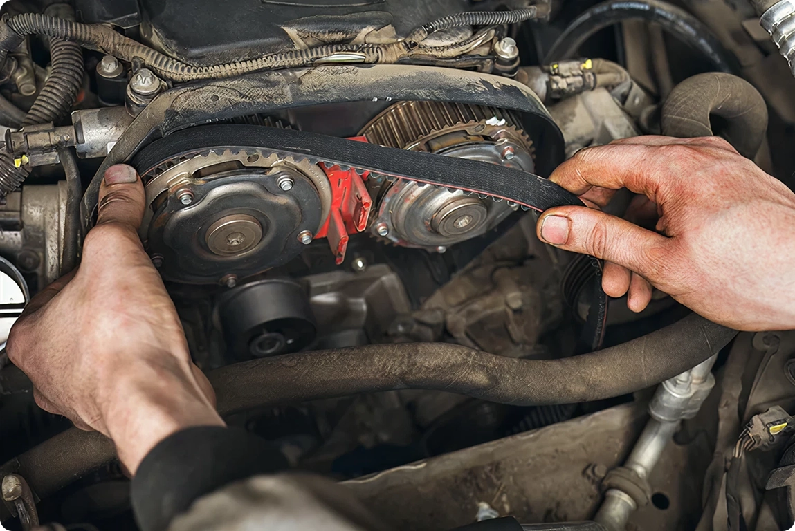 Professional worker replacing belts and hoses