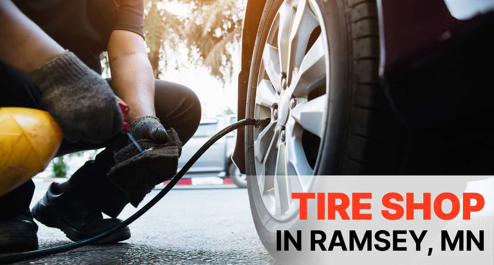 Tire technicians servicing SUV tires in Ramsey, MN