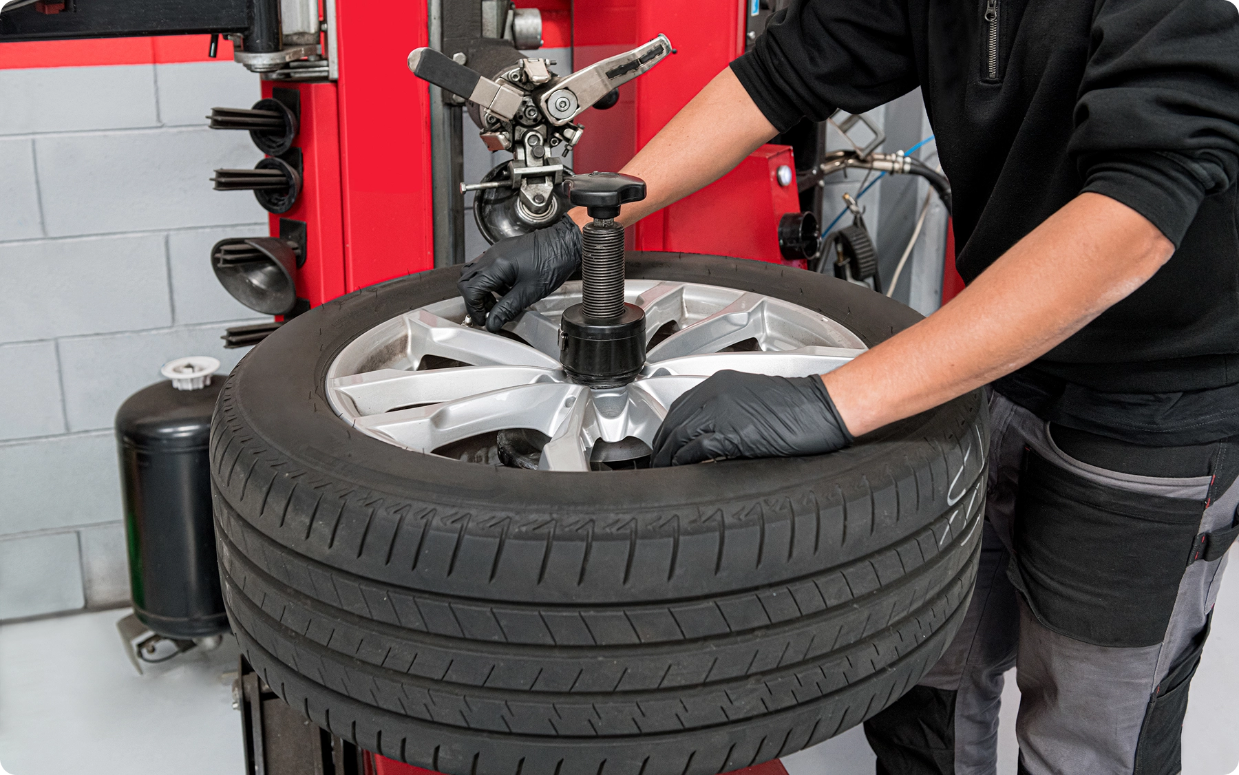 male operator dismantling tire work