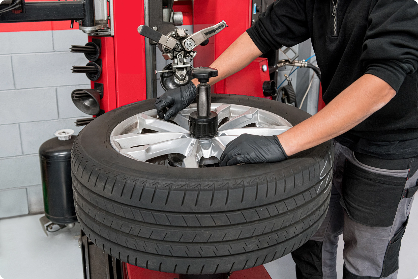 male operator dismantling tire
