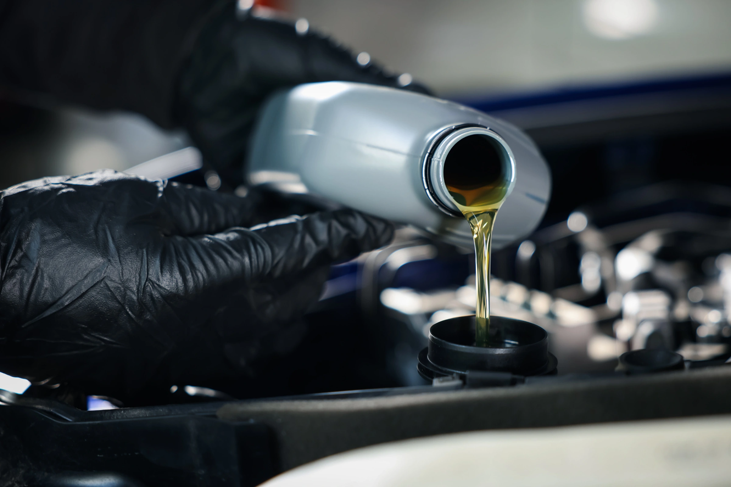 Technician performing oil change service in Brainerd, MN