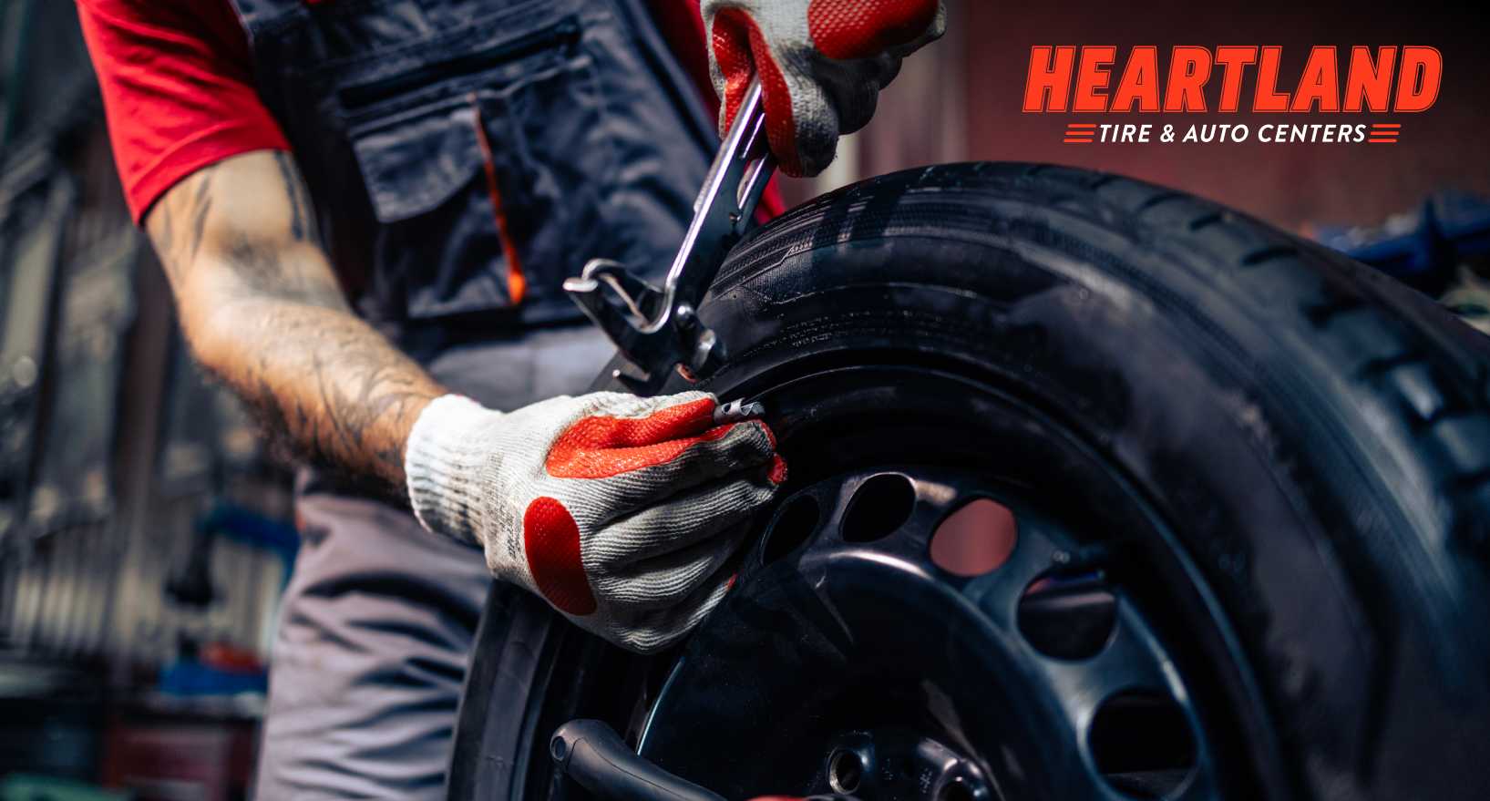 Technician checking tire pressure on a vehicle in Brooklyn Park MN