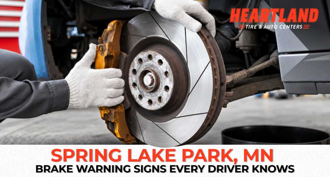 Mechanic inspecting brake pads at Heartland Tire & Auto Centers in Spring Lake Park MN